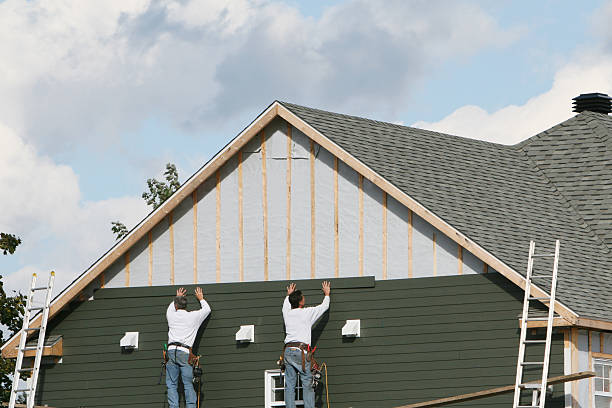 Professional Siding Installation technician working in Triadelphia, WV